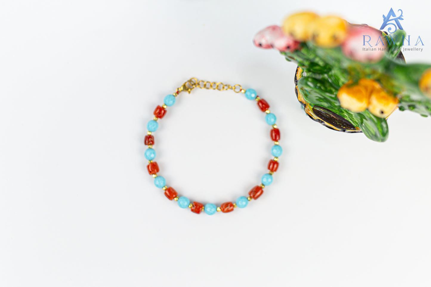 Handcrafted bracelet with natural coral and four-flower turquoise paste