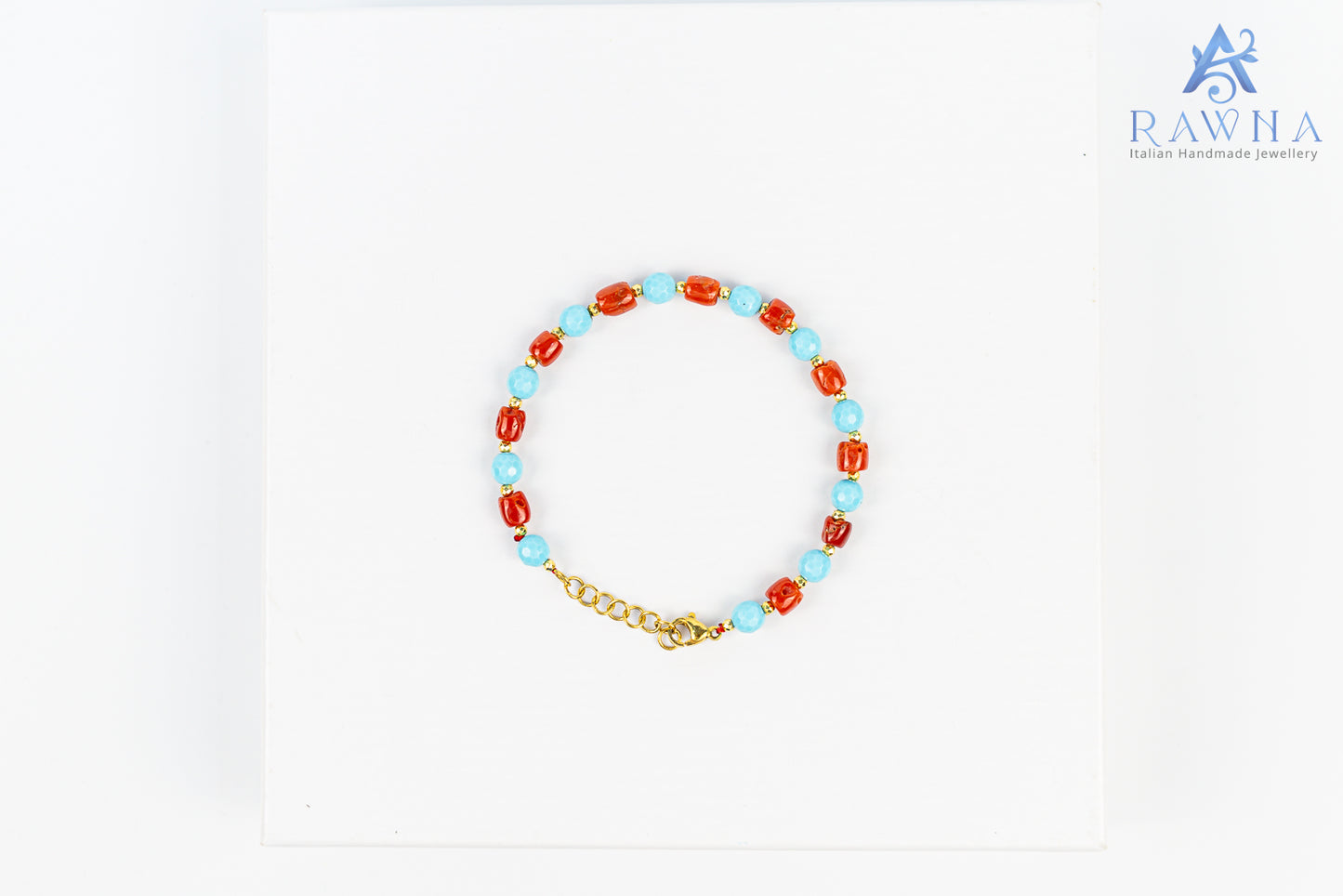 Handcrafted bracelet with natural coral and four-flower turquoise paste